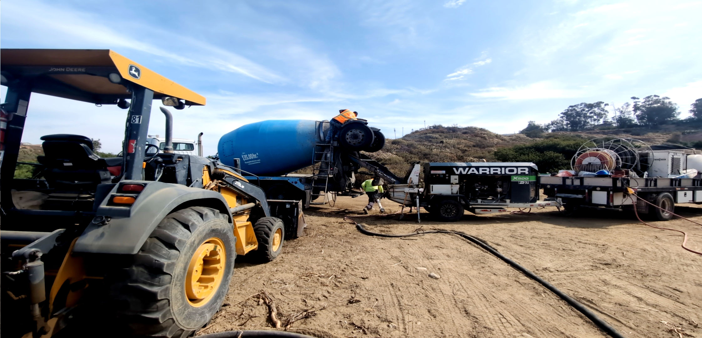 Tractor and heavy equipment at roadway and drainage construction site
